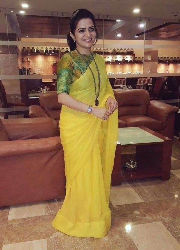 Plain Yellow Saree with contrast green blouse