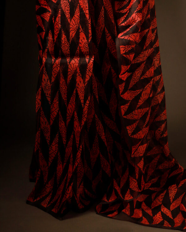 rn-image_picker_lib_temp_162dce68-4213-4a22-9dcd-7dfba73b8364 Sunset Noir Orange and Black Pure Organza Silk Saree
