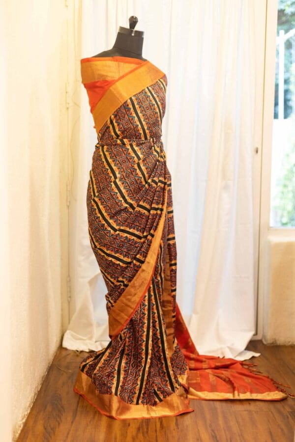 rn-image_picker_lib_temp_45763fe4-0dd0-4458-99b7-95b0109c8e0a Mystic Sunset Orange and Black Striped Printed Kanchipuram Silk Saree