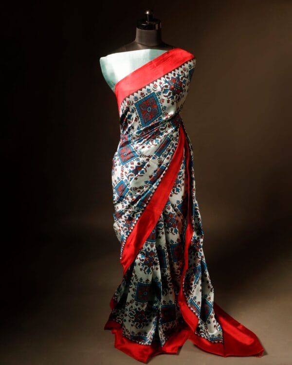 rn-image_picker_lib_temp_51a072c8-0c9d-4632-8461-b88bd7d5f86a Pure Hand block Printed Red and Grey Raw Silk saree