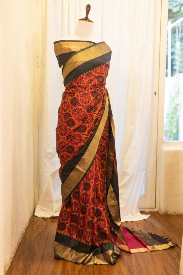 rn-image_picker_lib_temp_593b57f8-73fa-49d5-a67f-91341e315e36 Autumn Elegance Orange and Black Printed Kanchipuram Silk Saree