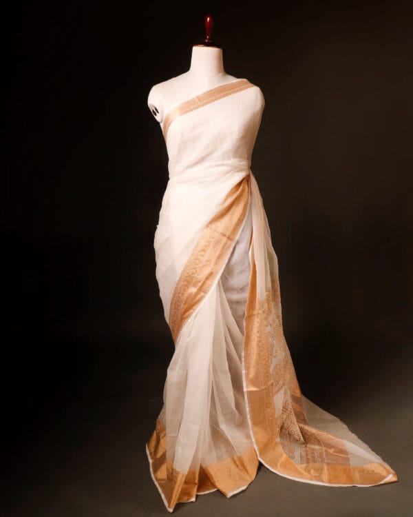 rn-image_picker_lib_temp_e0e9f4d8-869f-49e0-96a0-e055cccb944a Kerala Cotton Elegance Traditional Saree